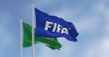 Zürih, CH, Kasım 4 2023: FIFA ve Suudi Arabistan bayrakları rüzgarda sallanıyor. 2034 FIFA Dünya Kupası 'nın 25.' sine Suudi Arabistan ev sahipliği yapacak. 3D canlandırma canlandırması. Ağır çekim. Seçici odak