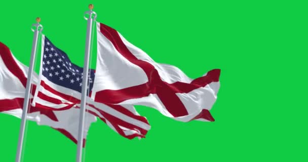 アラバマ州旗はアメリカ合衆国の国旗をグリーンスクリーンに掲げている シームレス3Dレンダリングアニメーション クロマキー スローモーションループ 4Kについて 選択的なフォーカス — ストック動画