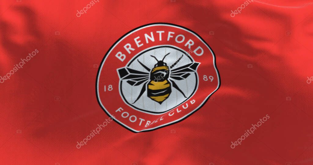 London, UK, Feb 19 2023: Close-up of Brentford Football Club flag waving. Circular emblem with a bee inside on red. Illustrative editorial 3d illustration render. Textured background