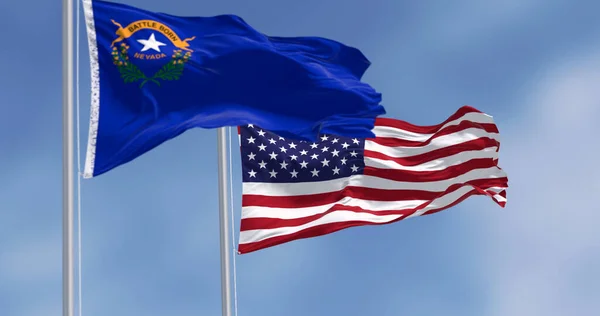 Nevada and american flag waving in the wind on a clear day. Cobalt blue field with a state emblem on the top left. 3d illustration render. Rippled fabric. Selective focus