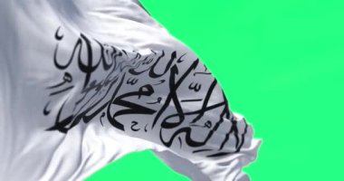 Afganistan 'daki İslami Emirliğin bayrağı yeşil ekranda rüzgarda sallanıyor. Kusursuz 3D canlandırma animasyonu. Krom anahtar. Yavaş çekim döngüsü. 4 bin. Seçici odak.