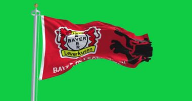 Leverkusen, DE, 2 Kasım 2023: Bayer Leverkusen bayrağı yeşil ekranda dalgalanmaktadır. Kusursuz 3D canlandırma animasyonu. Krom anahtar. Yavaş çekim döngüsü. 4 bin. Seçici odak.