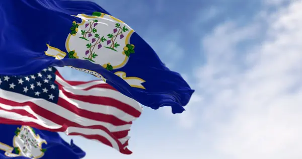 Connecticut and the United states flags waving in the wind on a clear day. US state flag. Pride and patriotism concept. 3d illustration render. Fluttering fabric