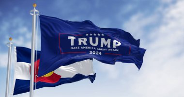 Denver, US, Dec.20 2023: Trump 2024 campaign flag waving with Colorado State flag. On Dec. 2023 Colorado Supreme Court Rules Trump Ineligible for Presidency. Illustrative editorial illustration clipart