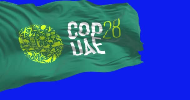 アラブ首長国連邦 ドバイ 11月30日2023 青いスクリーンで振るCop28旗の閉鎖 シームレス3Dレンダリングアニメーション クロマキー スローモーションループ 4Kについて 選択的なフォーカス — ストック動画