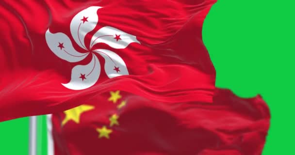 香港和中国的旗帜在绿屏上迎风飘扬 城市和中国的一个特别行政区 无缝3D渲染动画 慢动作回圈4K 有选择的重点 — 图库视频影像