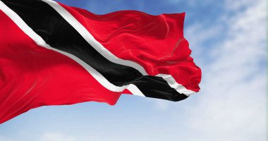 Trinidad and Tobago national flag waving on a clear day. The Republic of Trinidad and Tobago is an island state in the Caribbean. 3d illustration render. Rippled fabric. Selective focus. Close-up