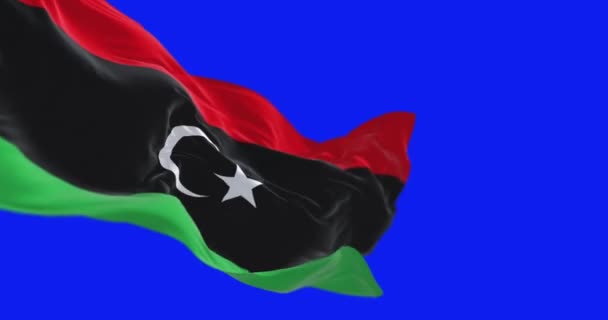 Національний Прапор Лівії Махає Ізольовано Синьому Фоні Безшовна Анімація Рендеринга — стокове відео