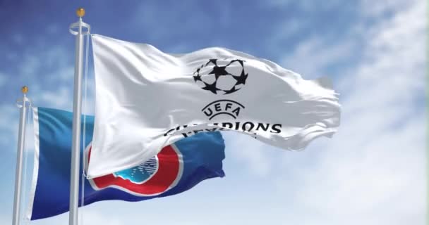 ロンドン イギリス 12月1日2023 UefaとUefaチャンピオンズリーグの旗が一緒に振る舞った ヨーロッパサッカー競技 シームレス3Dレンダリングアニメーション スローモーションループ — ストック動画