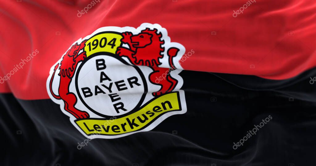 Leverkusen, DE, Nov. 2 2023: Close-up of Bayer Leverkusen flag waving. illustrative editorial 3d illustration render. Fluttering fabric. German Bundesliga Football club. Selective focus