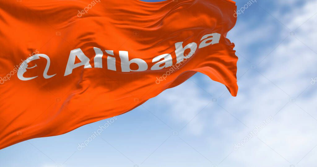 Hangzhou, CH, Jan. 12 2024: Orange flag with the Alibaba Group logo waving on a clear day. Alibaba is a Chinese multinational technology company. Illustrative editorial 3d illustration render