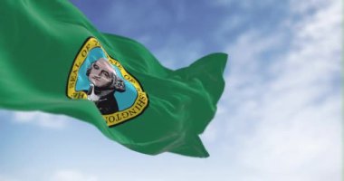 Washington eyaleti bayrağı açık havada dalgalanıyor. Üzerinde bir mühür olan koyu yeşil alan ortada George Washington 'ın resmini gösteriyor. Kusursuz 3 boyutlu animasyon. Yavaş çekim döngüsü. Seçici odak
