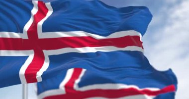 İki İzlanda ulusal bayrağının yakın çekimi. Beyaz haçlı mavi ve beyaz haçın içinde kırmızı haç. 3D illüstrasyon canlandırıcı. Kanat çırpan kumaş. Seçici odak