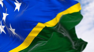 Solomon Adaları 'nın ulusal bayrağının yakın çekimi açık bir günde rüzgarda sallanıyor. Solomon Adaları, Okyanusya 'da bağımsız bir ülkedir. 3D illüstrasyon canlandırıcı. Seçici odak