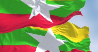 İki Myanmar ulusal bayraklarının yakın çekimi. Kusursuz 3 boyutlu animasyon. Yavaş çekim döngüsü. Seçici odak
