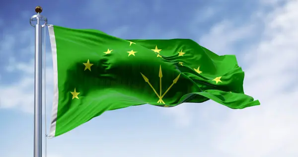 stock image The Circassian flag waving in the wind on a clear day. National flag of Republic of Adygea. Russian Federation. 3d illustration render. Fluttering fabric