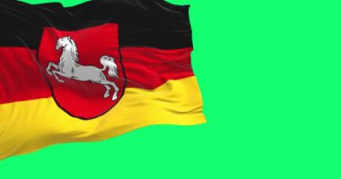 Aşağı Saksonya eyaleti bayrağı yeşil arka planda izole edildi. Kusursuz 3D canlandırma animasyonu. Krom anahtar. Yavaş çekim döngüsü. Yeşil ekran. 4K.