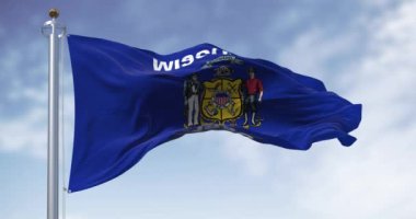 Wisconsin eyaletinin rüzgarda dalgalanan bayrağının yakın çekimi. Merkezi armalı mavi bayrak. Kusursuz 3 boyutlu animasyon. Yavaş çekim döngüsü. Seçici odak