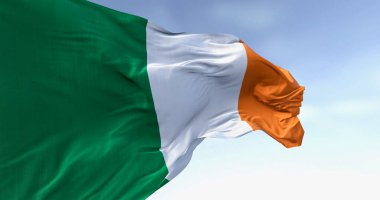 Ireland national flag waving in the wind on a clear day. Vertical tricolour of green, white, and orange. European Union state member. 3d illustration render. Fluttering fabric. clipart