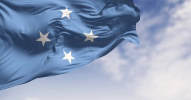 Flag of Federated states of Micronesia waving in the wind on a clear day. Independent state located in the Pacific Ocean. 3d illustration render. Selective focus clipart