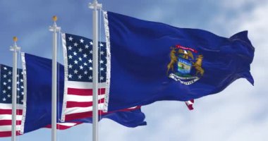 Michigan eyalet bayrağı ve açık havada rüzgarda dalgalanan ulusal Amerikan bayrağı. Gurur ve vatanseverlik kavramı. Kusursuz 3 boyutlu animasyon. Yavaş çekim döngüsü. Seçici odak.