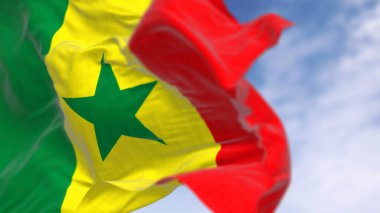 Close-up of Senegal national flag waving on a clear day. Tricolor with vertical bands with the traditional pan-African colors: green, yellow and red. 3d illustration render. Selective focus clipart