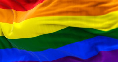 Rüzgarda dalgalanan gökkuşağı bayrağının 3D görüntüsü, LGBTQ + gurur, özgürlük, eşitlik ve çeşitliliğin sembolü.