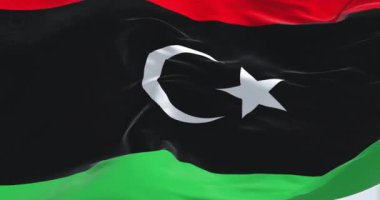 İslami hilal ve yıldızlı Libya ulusal bayrağı. Bağımsızlığın, birliğin, kimliğin ve vatanseverliğin sembolü. Kusursuz 3 boyutlu animasyon. Yavaş çekim döngüsü. Seçici odak