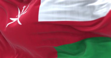 Umman 'ın milli bayrağı rüzgarda dalgalanıyor, Khanjar sembolü Omani gururu, geleneği ve sultanlık altındaki birliği temsil ediyor. Kusursuz 3 boyutlu animasyon. Yavaş çekim döngüsü. Seçici odak