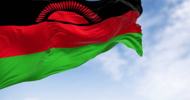 Malawi ulusal bayrağının açık bir günde rüzgarda dalgalanması. Siyah, kırmızı, yeşil çizgiler ve yükselen siyah bir güneş. 3D illüstrasyon canlandırıcı. Dalgalanan kumaş