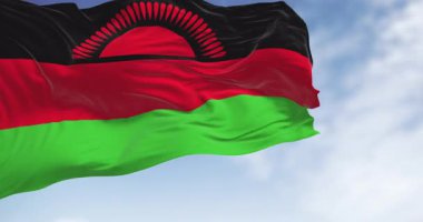 Malawi ulusal bayrağının açık bir günde rüzgarda dalgalanması. Siyah, kırmızı, yeşil çizgiler ve yükselen siyah bir güneş. Kusursuz 3 boyutlu animasyon. Yavaş çekim döngüsü. Seçici odak