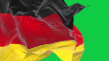 Almanya ulusal bayrağının rüzgarda dalgalanan yakın çekimi yeşil arka planda izole edildi. Kusursuz 3D canlandırma animasyonu. Krom anahtar. Yavaş çekim döngüsü. Yeşil ekran. 4 bin. Seçici odak