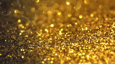 Şenlikli altın pullar üzerine Bokeh.