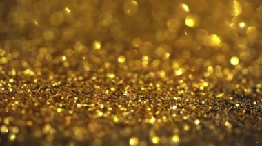 Şenlikli altın pullar üzerine Bokeh.