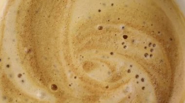 coffee with foam and bubbles close up macro