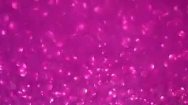Pembe bir arka planda şenlikli defocus bokeh