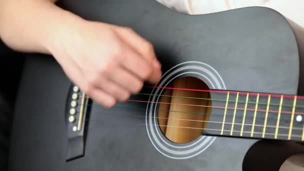 Close Man Hand Playing Black Guitar — Vídeos de Stock