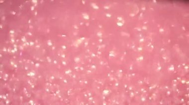 Pembe bir arka planda şenlikli defocus bokeh