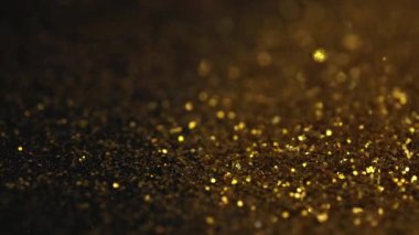 Şenlikli altın pullar üzerine Bokeh.