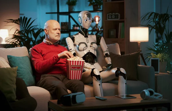 Senior Man Female Robot Sitting Couch Home Watching Movies Together — Stock Photo, Image