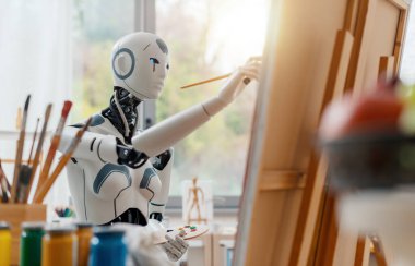 İnsansı yapay zeka robotu, resim stüdyosundaki tuvale bir yaşam kompozisyonu çiziyor.