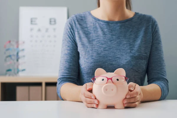 Woman Holding Piggy Bank Glasses Optician Shop Low Cost Eyewear — Stock Photo, Image