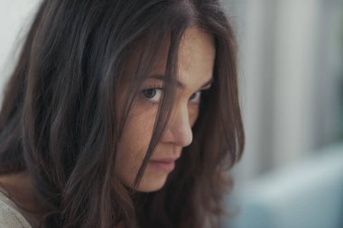 Sad young woman posing, she is feeling lonely and lost