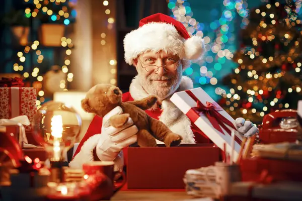Happy Santa Claus Sitting His Desk Preparing Gifts Christmas — Stock Photo, Image