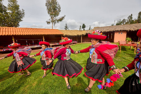 Dressed in their beautifully woven garments, the people of Chinchero come together in a joyful celebration of culture, heritage, and community.
