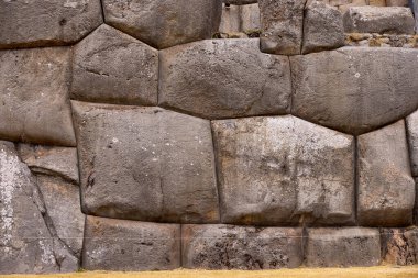 SACSAYHUAMAN  fortress showcases massive, perfectly fitted stones, some weighing over 100 tons. A marvel of engineering and architecture.. clipart