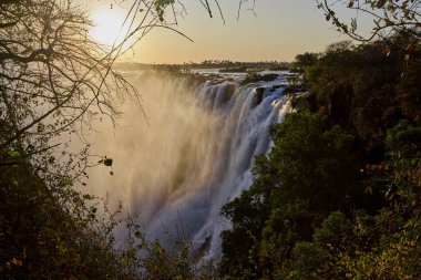 Victoria Falls, one of the Seven Natural Wonders of the World, is a breathtaking sight located on the border between Zambia and Zimbabwe. Known locally as 