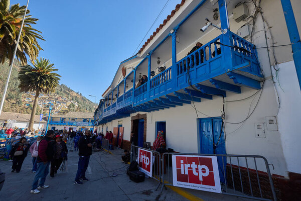 balconies adorned with blue woodwork, locals and visitors gather to witness the dazzling dances, music, and faith that honor the Virgen del Carmen.