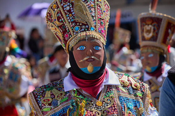 the Qhapaq Chunchu dancers of Paucartambo embody the Amazonian spirit during the Virgen del Carmen festivities. Their colorful costumes, feathered crowns, and striking masks reflect centuries of tradition, devotion, and cultural identity