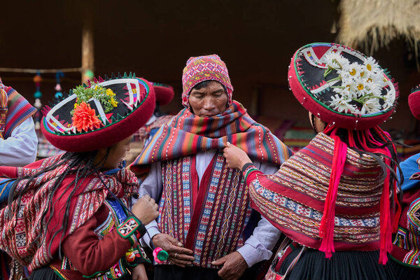  Dressed in their beautifully woven garments, the people of Chinchero come together in a joyful celebration of culture, heritage, and community.